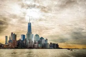 a large body of water with a city in the background