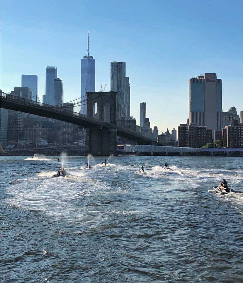 jet ski tour rider on the manhattan waterways near Brooklyn bridge