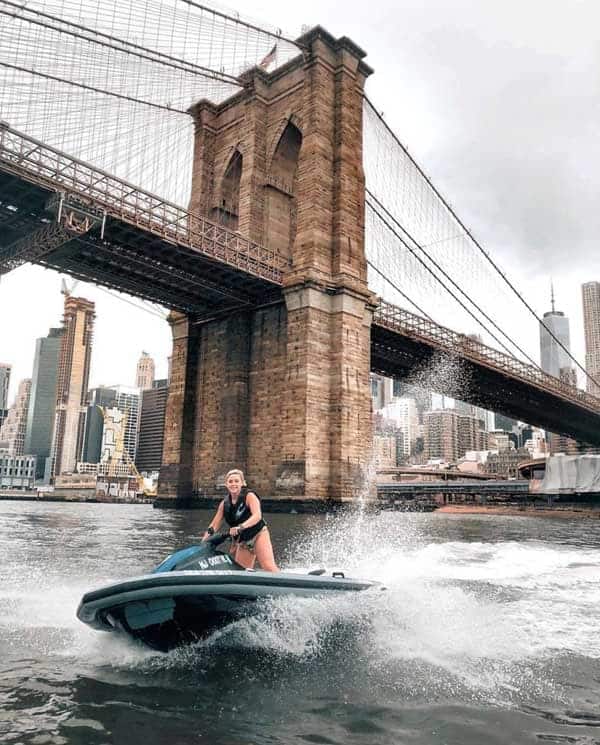 Jet skiing by the Brooklyn Bridge