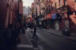 a group of people walking on a city street