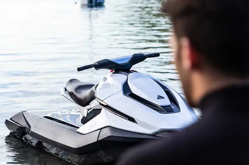 a man sitting in a boat on a body of water