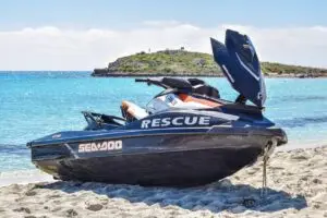 a boat sitting on top of a sandy beach
