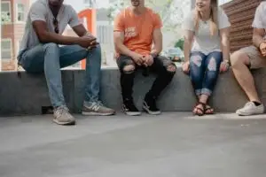 a group of people sitting on a bench