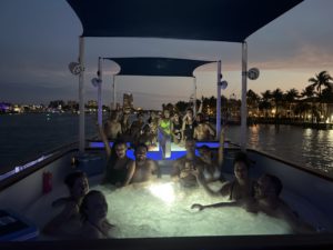 Party on hot tub boat at night in fort Lauderdale, FL