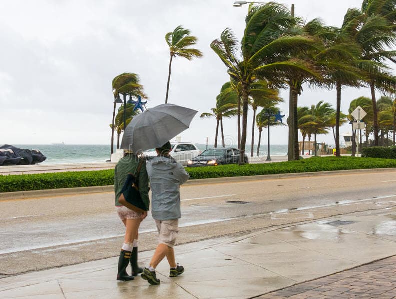 People walking in the rain in Fort Lauderdale, FL