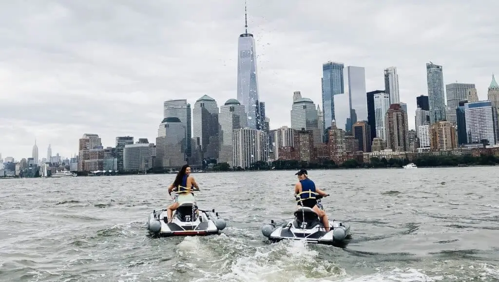 a group of people riding on the back of a boat