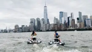 a group of people riding on the back of a boat