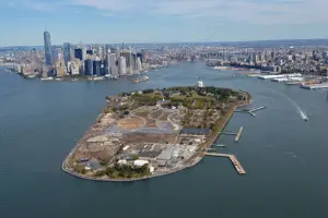 Aerial view of Governors Island with Manhattan skyline in the background.