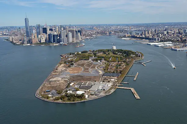 Aerial view of Governors Island with Manhattan skyline in the background.