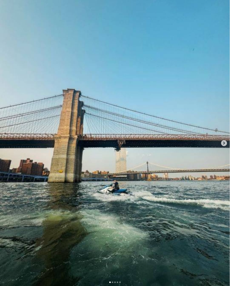Jet ski tour cruising under the Brooklyn Bridge