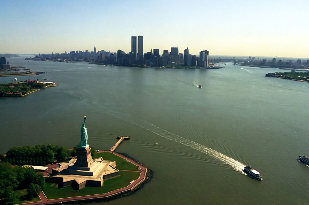 The Statue of Liberty and Lower Manhattan seen from a helicopter over New York Harbor