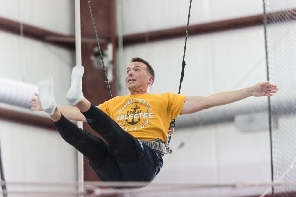 U.S. Navy Band members at a team-building event at Trapeze School New York, 2017