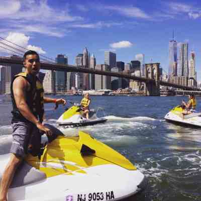 a man standing on a boat in the water