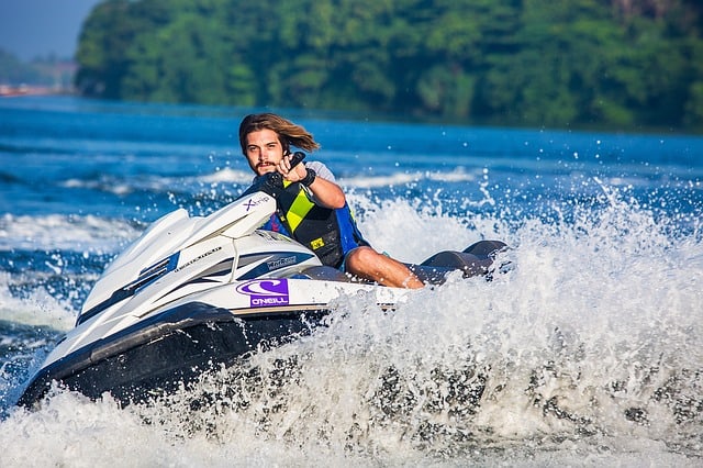 a man riding a wave on a surf board on a body of water