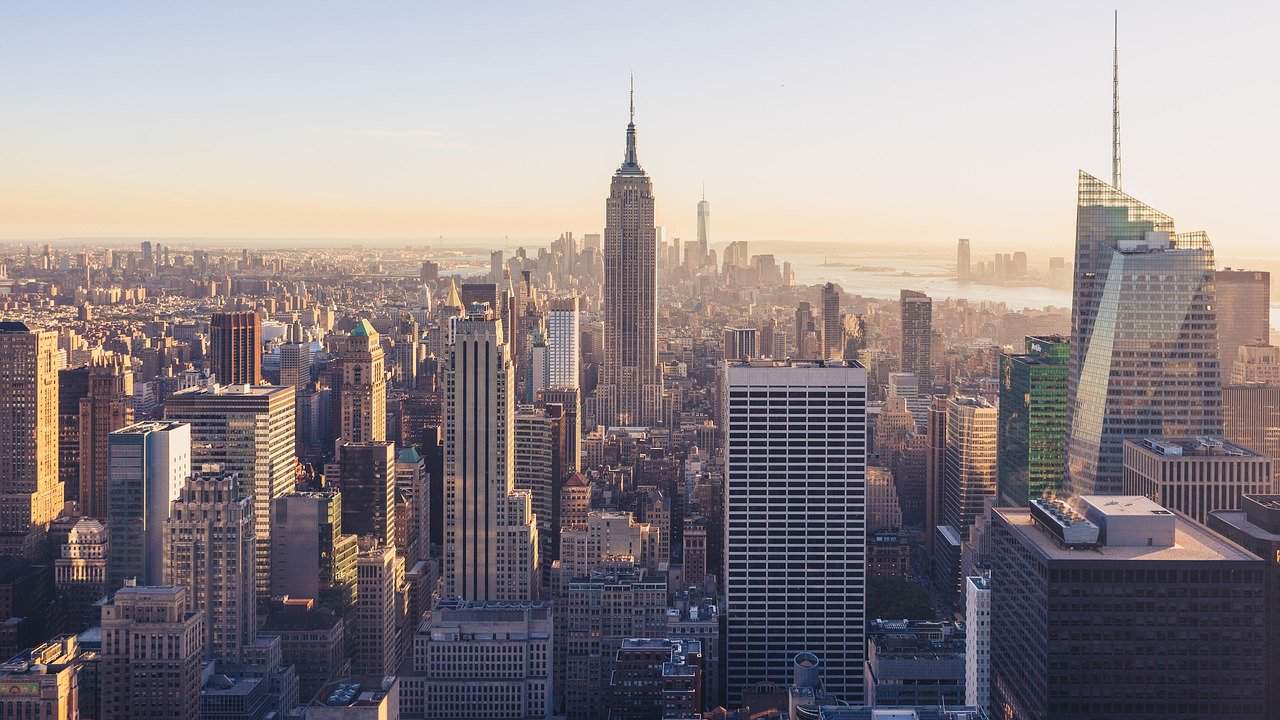 The New York City Neighborhood Guide a large skyscraper in a city