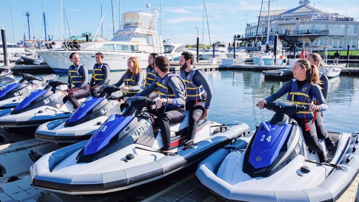 a group of people on a boat in the water