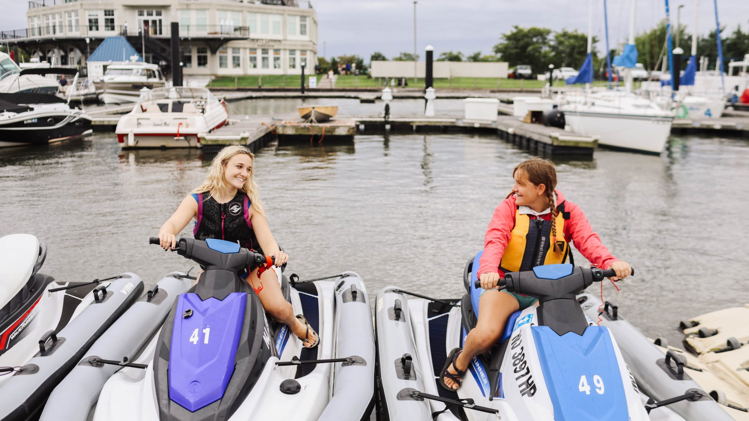 a group of people in a boat on a body of water
