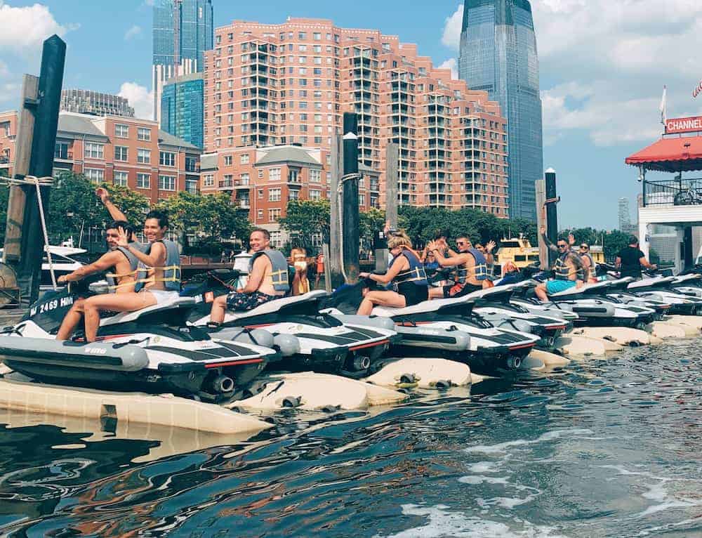 a body of water with a city in the background
