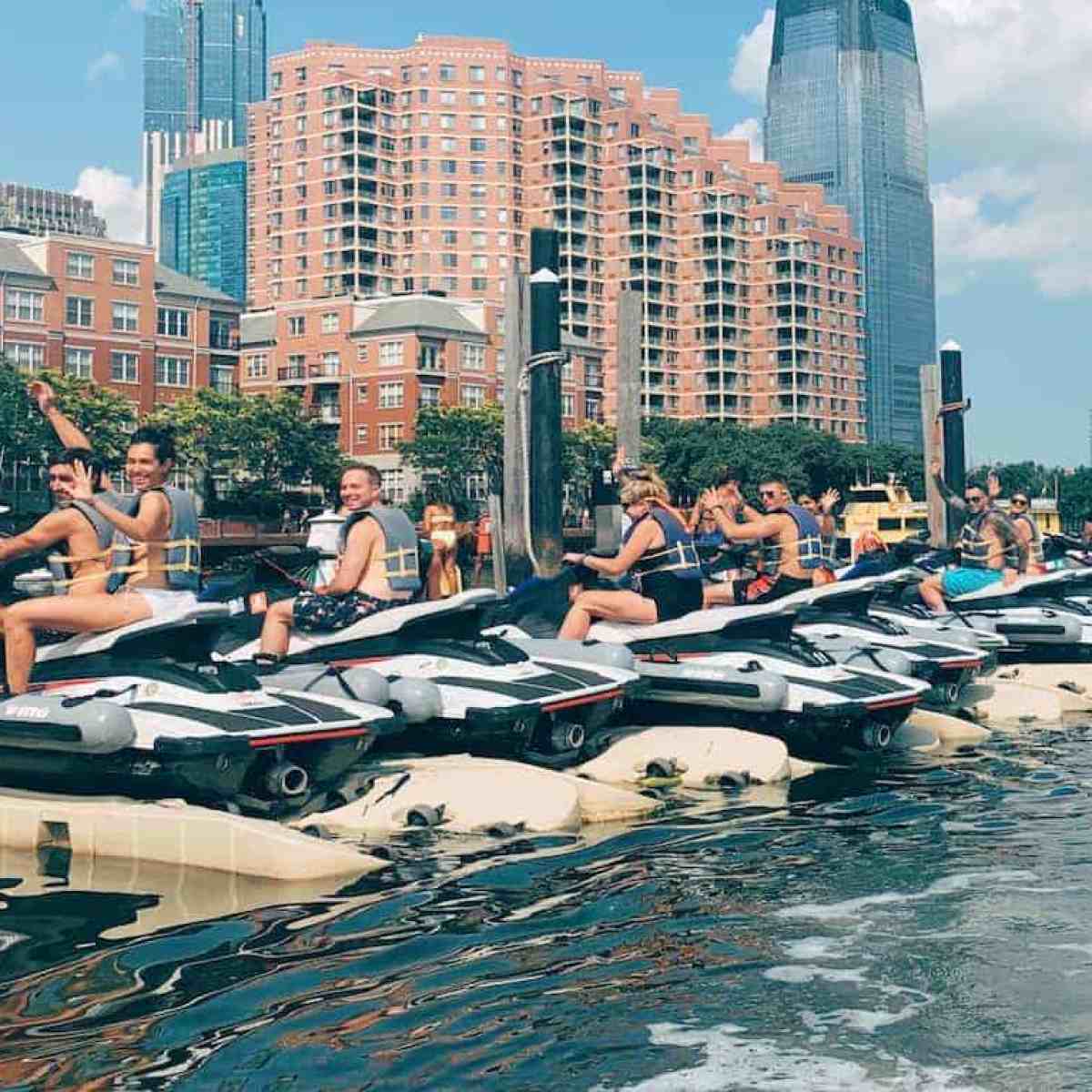 a body of water with a city in the background