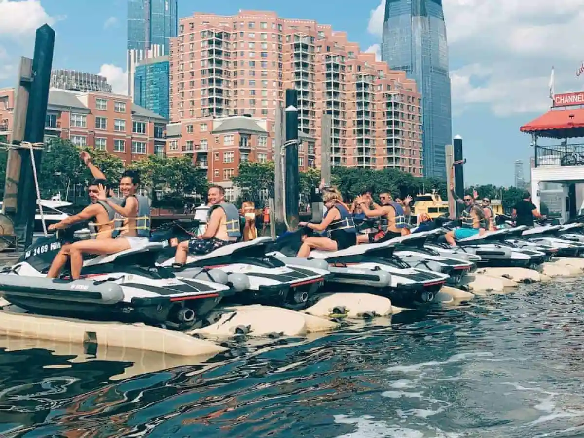 a body of water with a city in the background