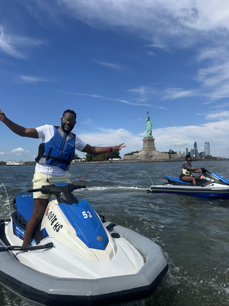 jet skiing in front of the statue of liberty